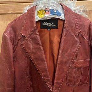 Brown leather jacket, pockets in side need some leather conditioner on it.